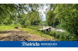 Grundstück zu kaufen in 26215 Wiefelstede, Wald- und Wiesengrundstück mit Wasserfläche, Holzhütte und Sichtschutzwall in Wiefelstede