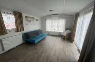 Wohnung kaufen in 63517 Rodenbach, Wohnqualität auf kleinem Raum-Mobilheim mit Terrasse & Garten
