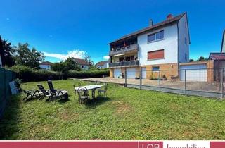 Haus kaufen in 55593 Rüdesheim, Zweifamilienhaus mit großzügigem Grundstück, drei Garagen und viel Potenzial