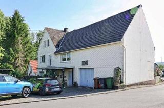 Einfamilienhaus kaufen in 56459 Kölbingen, Kölbingen - Gemütliches Einfamilienhaus mit Scheune, viel Flair und liebevoll angelegtem Garten (inklusive Gästehaus) in Kölbingen