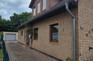 Haus kaufen in 27612 Loxstedt, Loxstedt - Zweifamilienhaus mit Wintergarten und Garage