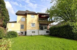 Einfamilienhaus kaufen in 53797 Lohmar, Gepflegtes, modernisiertes Einfamilienhaus mit vermieteter ELW, EBK, 2 Loggien, 2 Garagen + Garten