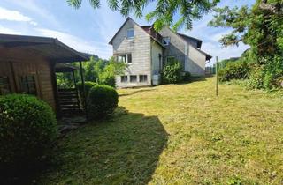 Haus kaufen in 61389 Schmitten, Solides Zweifamilienhaus mit zusätzlichen Bauplätzen im beliebten Schmittener Stadtteil Arnoldshain
