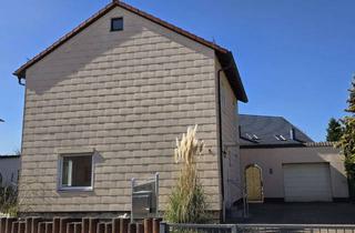 Einfamilienhaus kaufen in 67728 Münchweiler, 1450 Ruhiges, freistehendes Einfamilienhaus mit Wintergarten und Garage in Münchweiler an der Alsenz