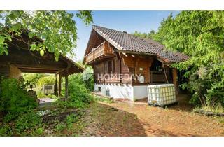 Haus kaufen in 97852 Schollbrunn, Alpines Wohngefühl im Grünen – Uriges Holzhaus mit Scheune, großem Garten und 2 Balkonen