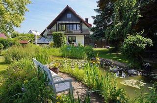 Einfamilienhaus kaufen in 90562 Heroldsberg, Wohnen auf höchstem Niveau – Freistehendes Einfamilienhaus mit Einliegerwohnung & Parkgarten in Heroldsberg