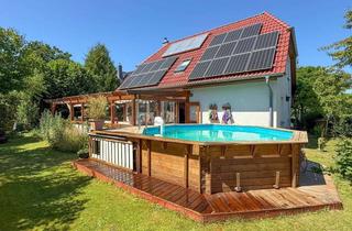 Einfamilienhaus kaufen in 25436 Heidgraben, Nachhaltig wohnen – Einfamilienhaus mit Kamin, Pool & PV-Anlage