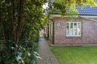 Einfamilienhaus kaufen in 25566 Lägerdorf, Lägerdorf - Junger Winkelbungalow aus 2010 mit viel Platz und Ausbaureserve