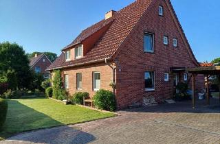 Haus kaufen in 26969 Butjadingen, Solides Zweifamilienhaus auf großem Grundstück in der Gemeinde Butjadingen/ Ortsteil Ruhwarden
