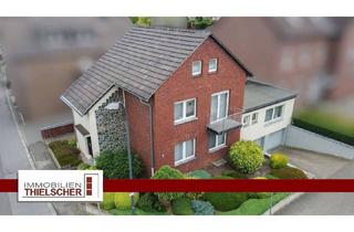Haus kaufen in 52499 Baesweiler, Baesweiler - Großzügiges Zweifamilienhaus mit Balkon, Terrasse, Garten und 2 Tiefgaragen im idyllischen Loverich