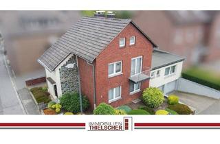 Haus kaufen in 52499 Baesweiler, Baesweiler - Großzügiges Zweifamilienhaus mit Balkon, Terrasse, Garten und 2 Tiefgaragen im idyllischen Loverich