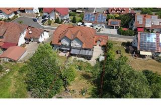 Wohnung kaufen in 97514 Oberaurach, Oberaurach - Wohnung mit großem Garten und zwei Garagen in ruhiger Lage