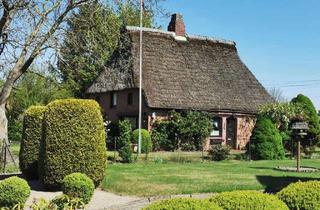 Haus kaufen in 25569 Krempermoor, Reetdachhaus mit historischem Charme in Krempermoor
