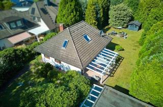 Einfamilienhaus kaufen in 21266 Jesteburg, Jesteburg - Walmdachbungalow mit Doppelgarage & Baupotential auf Traumgrundstück in Jesteburg