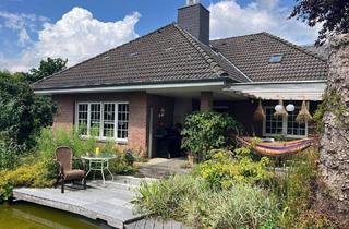 Einfamilienhaus kaufen in 23626 Ratekau, Ratekau - Charmantes Einfamilienhaus mit Keller, Einliegerwohnung, Teich und Doppelgarage