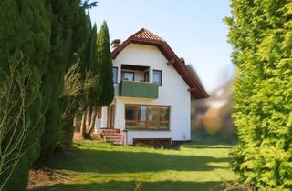 Haus kaufen in 37697 Lauenförde, Lauenförde - Architektenhaus mit Wellnessbereich, Kachelofen und Gartenidylle