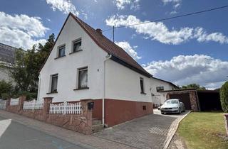 Einfamilienhaus kaufen in 55444 Schweppenhausen, Charmantes Einfamilienhaus mit Garten, Garage und großzügigem Raumangebot in ruhiger Lage