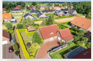 Einfamilienhaus kaufen in 26556 Eversmeer, Familienfreundliches Wohnen in Sackgassenendlage - Einfamilienhaus mit Garage in Eversmeer!