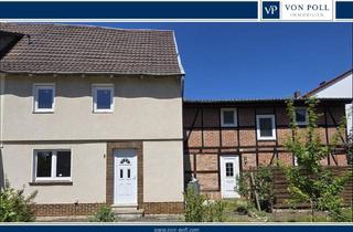 Doppelhaushälfte kaufen in 37276 Meinhard, Doppelhaushälfte, die einer Sanierung bedarf, mit Anbau