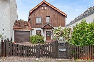 Einfamilienhaus kaufen in 63110 Rodgau, Gemütliches Einfamilienhaus mit schönem Garten und viel Potenzial in Rodgau