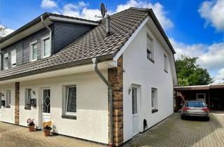 Doppelhaushälfte kaufen in 26219 Bösel, Attraktive Kapitalanlage im Zentrum von Bösel: Doppelhaushälfte mit Carport!