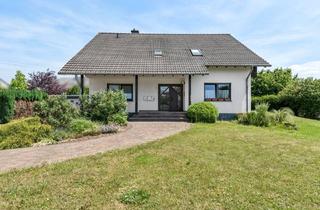 Haus kaufen in 55494 Rheinböllen, Teilvermietet - Zweifamilienhaus in Rheinböllen