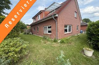 Haus kaufen in 27313 Dörverden, Dörverden-Wahnebergen: Zuverlässig vermietetes Zweifamilienhaus mit Doppelgarage in ruhiger Wohnlage