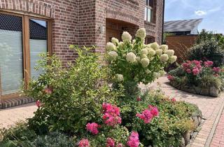 Einfamilienhaus kaufen in 33428 Harsewinkel, Harsewinkel - Traumhaus im Landhausstil mit Gartenparadies - Wohnen mit Stil und Komfort