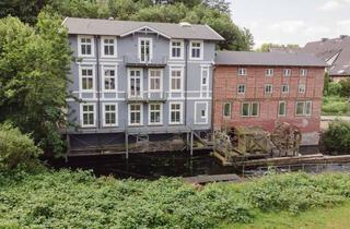 Wohnung kaufen in Eutiner Straße, 23714 Malente, Kernsanierte Obergeschosswohnung in der historischen Gremsmühle an der Schwentine