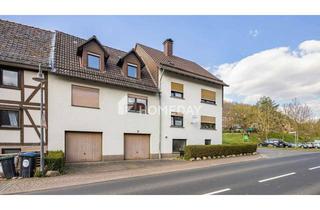 Anlageobjekt in 37247 Großalmerode, Modernisiertes MFH mit vier Wohneinheiten, großem Garten und drei Garagen