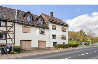 Haus kaufen in 37247 Großalmerode, Großalmerode - Modernisiertes MFH mit vier Wohneinheiten, großem Garten und drei Garagen