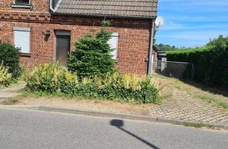 Doppelhaushälfte kaufen in 41812 Erkelenz, Erkelenz - Haus mit großem Garten und Wintergarten mit Grage