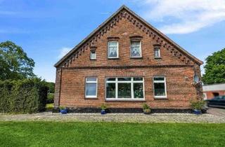 Mehrfamilienhaus kaufen in 26349 Jade, Jade - Mehrfamilienhaus mit 4 Wohneinheiten + Bauland