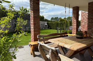 Wohnung kaufen in 34225 Baunatal, Baunatal - Moderne Maisonette-Wohnung mit Garten, Kamin und Doppelgarage