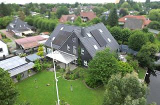 Einfamilienhaus kaufen in 26725 Wolthusen, Exklusives Wohnen am Wasser: Einfamilienhaus in direkter Kanallage in Tholenswehr