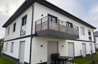 Wohnung kaufen in 26969 Butjadingen, Butjadingen / Tossens - Neubau-Ferienwohnung mit Sauna, Kamin und Mobiliar!