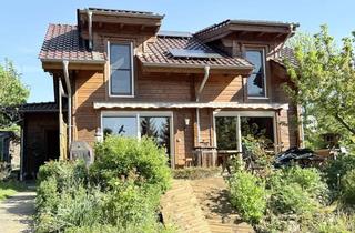 Haus kaufen in 55127 Marienborn, Naturidylle trifft Wohnkomfort – Charmantes Holzhaus mit Schwimmteich in traumhafter Feldrandlage