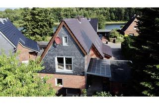Haus kaufen in 24784 Westerrönfeld, Zweifamilienhaus am Kanal - Wohnen und Mietertrag