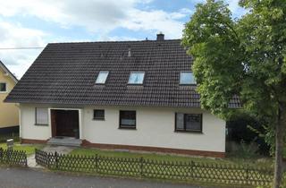 Haus kaufen in 57632 Reiferscheid, Solides Ein- bis Zweifamilienhaus mit Garten und zwei Balkonen – Wohnen auf ca. 183 m²