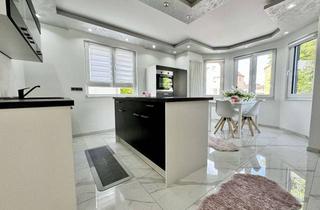Wohnung kaufen in 65474 Bischofsheim, Moderne kernsanierte 3 Zimmer Wohnung mit Terrasse und Garten in begehrter Lage von Bischofsheim