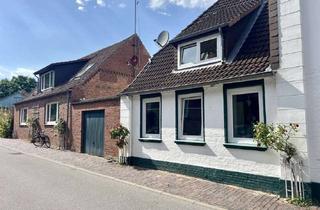 Haus kaufen in 25797 Wöhrden, Attraktives Immobilienensemble mit Mieteinnahmen, freier Wohnung und Entwicklungspotenzial