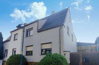 Doppelhaushälfte kaufen in 04509 Krostitz, Raum für Visionen – Vermietete Doppelhaushälfte mit Nebengelassen, Garten und Garage