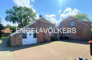 Mehrfamilienhaus kaufen in 26409 Wittmund, Attraktives Mehrfamilienhaus mit Baugrundstück – Kapitalanlage mit Entwicklungspotenzial