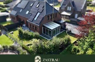 Doppelhaushälfte kaufen in 26556 Nenndorf, Architektur trifft Energieeffizienz – neuwertige Doppelhaushälfte
