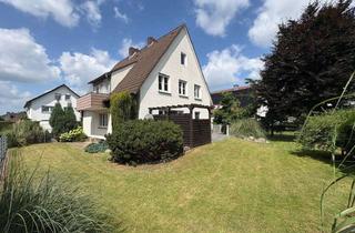 Haus kaufen in 33335 Gütersloh, Attraktives Zweifamilienhaus in Gütersloh-Avenwedde mit vielseitigen Nutzungsmöglichkeiten
