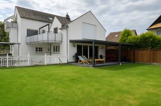 Wohnung kaufen in 65474 Bischofsheim, Großzügige Maisonettewohnung mit Haus-im-Haus-Charakter, Garten & 3 Stellplätzen in Bischofsheim