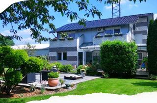 Einfamilienhaus kaufen in 46419 Isselburg, Einfamilienhaus in Isselburg - Grüner Rückzugsort und zentrale Gewerbeimmobilie