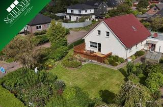 Einfamilienhaus kaufen in 27639 Nordholz, Hier parkt man doppelt gern – Einfamilienhaus mit Gartenidylle.