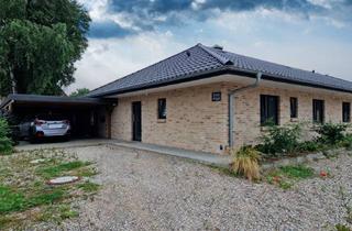 Mehrfamilienhaus kaufen in 25873 Oldersbek, Neuwertiger Bungalow in ruhiger Lage mit Carport und Abstellräumen