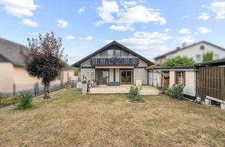 Haus kaufen in 35321 Laubach, Großzügiger Bungalow mit Anbau und weitläufigem Grundstück – ideales Zuhause für Familien
